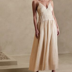 Pleated Banana Republic cream colored for and flare A line dress.
